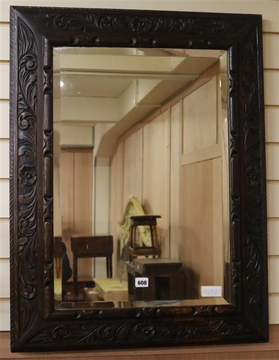 An early 20th century carved oak wall mirror, W.67cm H.87cm